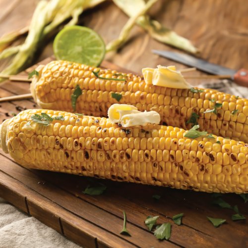 Grilled corn with herb butter — delicious side with any dish.